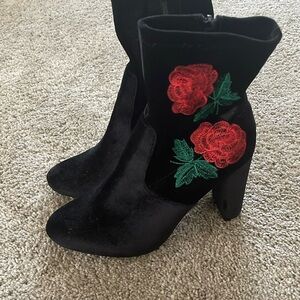 Black ankle boots with rose
